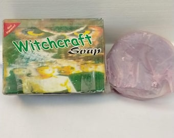 May include: A bar of Witchcraft Soap in a box with green and yellow text and a purple, wrapped soap bar. The box has an owl graphic and the words "New Improved". The soap is a light purple color.