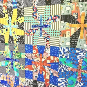 May include: A patchwork quilt featuring a repeating star-like block pattern constructed from various fabrics. The design incorporates a diverse array of colors including yellow, blue, orange, and black, with patterns such as polka dots, stripes, and illustrations.