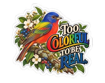 Pode incluir: Um autocolante recortado com um pássaro papa-laranja colorido pousado num ramo coberto de musgo com flores brancas e bagas azuis. O texto "TOO COLORFUL TO BE REAL." está impresso numa fonte multicolorida, arrojada e estilizada.