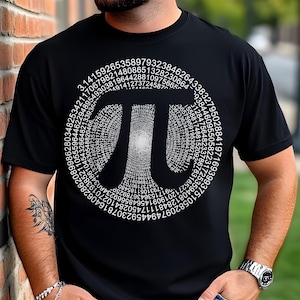 May include: Black t-shirt with a white graphic of the mathematical constant Pi, represented by the Greek letter π, formed by a spiral of digits of Pi.