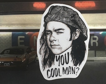 May include: Black and white illustration of a person with long hair wearing a hat. The text "You cool man?" is below the image.