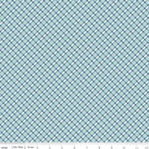 Pode incluir: Um tecido xadrez azul claro e branco com um padrão diagonal. O tecido tem um design em grade com linhas que se cruzam em tons de azul e branco. A imagem inclui uma régua com polegadas.