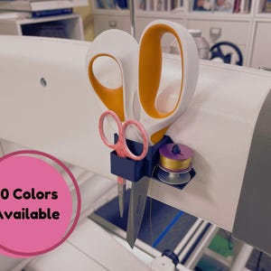 May include: A blue 3D printed sewing machine accessory with a spool of thread, a pair of pink scissors, and a pair of orange and white scissors. The text "10 Colors Available" is on a pink circle.