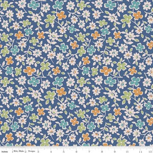 May include: A blue fabric with a floral pattern. The design features small white flowers and clusters of flowers in shades of orange, green, and teal. The fabric is measured in inches.