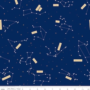 May include: Dark blue fabric featuring constellations with white dots and lines, labeled with zodiac signs in tan rectangles. Includes constellations like Sagittarius, Gemini, and Virgo. Small gold dots are scattered across the fabric.