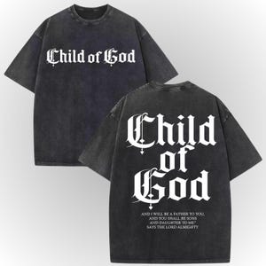 a black t-shirt with white text and a Bible verse printed on the back.