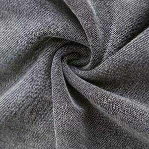 a close-up view of a wrinkled gray fabric, possibly denim or a similar type of material.