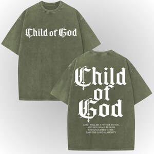 A green t-shirt with white text and a Bible verse printed on the back.