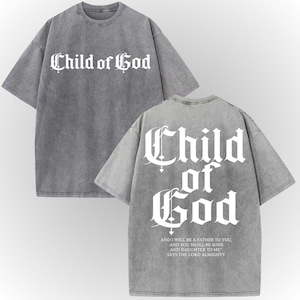 a gray t-shirt with the text "Child of God" printed on it in a Gothic font.