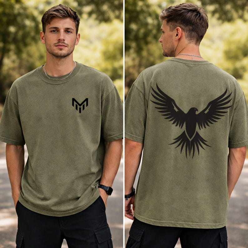 A man wearing a green t-shirt with a graphic design on the back.
