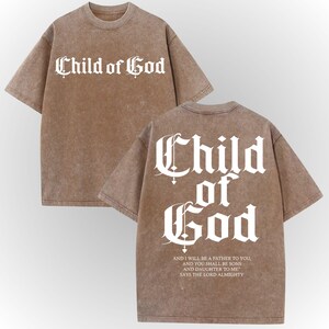 a brown t-shirt with the text "Child of God" printed on it in a Gothic font.