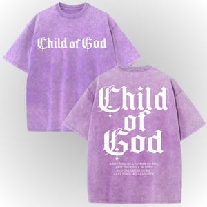 a purple t-shirt with the text "Child of God" printed on it in a Gothic font.