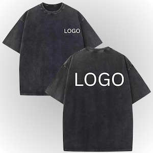 a pair of black t-shirts with the word "LOGO" printed on the back.
