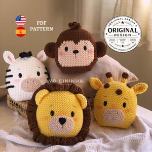 May include: A collection of four crocheted animal-shaped plush toys: a zebra, a monkey, a lion, and a giraffe. The toys are in various colors, including white, brown, yellow, and black. The image also includes text that says "PDF PATTERN" and "ORIGINAL DESIGN".