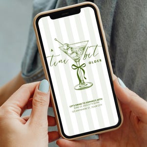 May include: A smartphone displays a green and white invitation design. The invitation features a martini glass illustration with olives and the text "A Tini Bit Older." Additional text includes event details: date, time, and location.