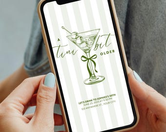 May include: A smartphone displays a green and white invitation design. The invitation features a martini glass illustration with olives and the text "A Tini Bit Older." Additional text includes event details: date, time, and location.
