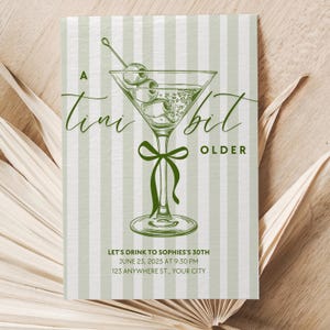May include: A green and white striped invitation with a martini glass illustration and the text "A tiny bit older". The invitation is for a 30th birthday party. The text also includes the date, time, and location of the party.