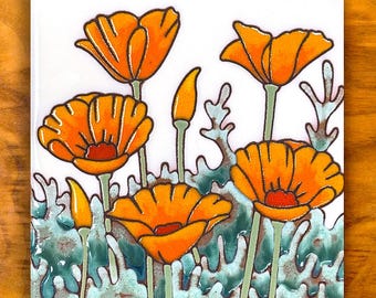 May include: Square ceramic tile featuring a vibrant floral design. The artwork showcases orange poppy flowers with green stems and leaves against a white background. The tile is set against a wooden surface.