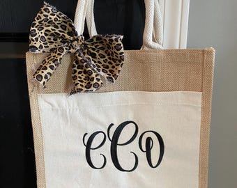 Borsa a mano/borsa in tela monogrammata con fiocco in tessuto