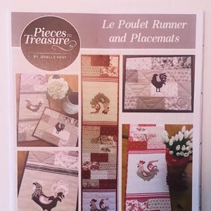 May include: A sewing pattern for a table runner and placemats featuring a rooster design. The pattern is called "Le Poulet Runner and Placemats" and is made with tea toweling. The runner measures 12 inches by 62 inches and the placemat measures 12 inches by 15 inches.