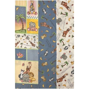 May include: Patchwork fabric with animal illustrations, including elephants, giraffes, zebras, and lions. The fabric uses blue, yellow, and white, with palm trees and crescent moons. The text "Sweet dream hugs from featherbeds" is visible.
