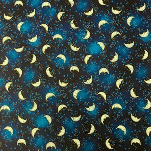 CELESTIAL DREAMS Original Release by Laurel Burch  for Clothworks.100% Cotton Quilt Fabric.  Dark Blue Moons - Sold by the 1/4 yard.10&quot;x WOF