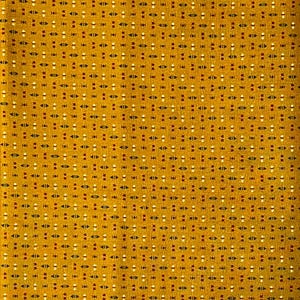 May include: Mustard yellow fabric with a repeating pattern of small white, red, and black shapes. The design includes small triangles and dots, creating a textured appearance. This textile is suitable for various sewing projects.