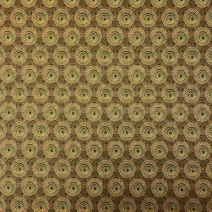 May include: A repeating pattern of concentric circles in shades of gold and brown. The circles are evenly spaced across the surface, creating a textured, visually engaging design. The pattern is suitable for various applications, such as fabric or wallpaper.