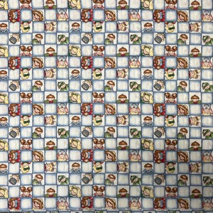 May include: A patterned fabric featuring a grid design with cartoon children. Each square contains a different child wearing a hat and carrying a backpack. The grid is light blue on a white background.