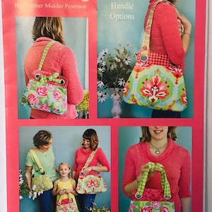 May include: A sewing pattern for a Bella Bag with three size and handle options. The pattern includes photos of the bag in different sizes and colors. The pattern is by Heather Mulder Peterson and is part of Anka's Treasures.