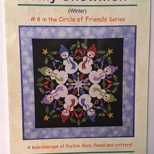 May include: A quilting pattern for a winter-themed quilt featuring a circle of snowmen with holly, birds, and stars. The pattern is titled "Silly Snowmen" and is part of the "Circle of Friends Series".