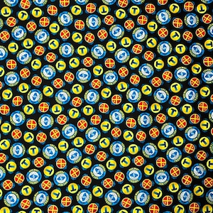 May include: A black fabric featuring a repeating pattern of circular icons. The design includes blue circles with the text Railway Friends, yellow circles with a letter T, and red circles with a cross symbol, all arranged in a dense grid.