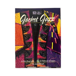 May include: A book cover titled "Jacket Jazz Encore" featuring a colorful patchwork jacket design. The cover includes text that reads "Six More Great Looks... Over 30 Patchwork Techniques by Judy Murrah."