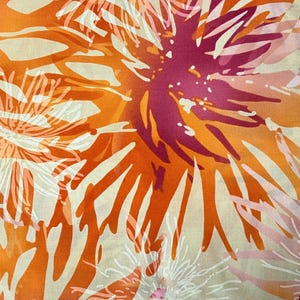 May include: Abstract floral print fabric in shades of orange, pink, and white. The fabric features a repeating pattern of stylized flowers with a textured, watercolor-like effect.
