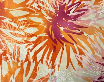 May include: Abstract floral print fabric in shades of orange, pink, and white. The fabric features a repeating pattern of stylized flowers with a textured, watercolor-like effect.