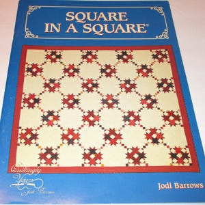 May include: A quilting pattern book titled "Square in a Square" by Jodi Barrows. The cover features a quilt design with a red, white and black colour scheme.