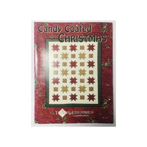 May include: A book cover for a quilting pattern called "Candy Coated Christmas" by Lynette Jensen. The cover features a red, white, and gold quilt with a star pattern.