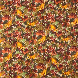 May include: A fabric featuring a repeating pattern of monkeys and tropical foliage. The monkeys are yellow-orange, and the leaves are shades of green, brown, and orange. The background is a light beige.