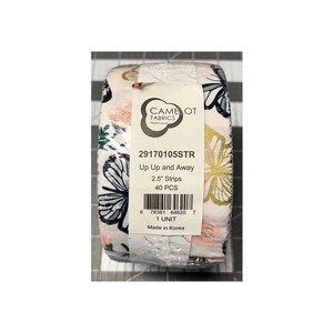 May include: A roll of fabric strips featuring a butterfly design in white, gold, pink, and navy blue. The label states "Up Up and Away" and "2.5" Strips". The fabric is from Camelot Fabrics.