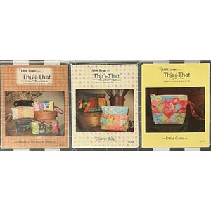May include: Three colorful sewing pattern booklets. The booklets feature images of fabric pouches and bags. The titles include "Abby's Treasure Box", "Clutter Bug", and "Little Cutie". The booklets are from "Little Scraps This & That".