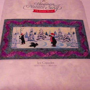 May include: A quilting pattern featuring two black bears ice skating on a frozen lake with a purple and blue border. The pattern is titled "Ice Capades" and is from the "Heaven and Nature Sing" collection by McKenna Ryan. The finished quilt size is 42 1/2" x 22 1/2" with a block size of 12 1/2".