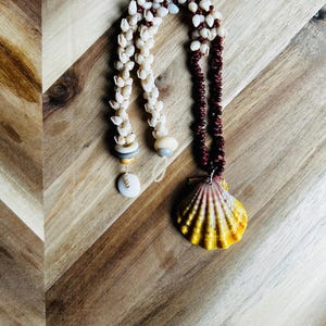Hawaiian Shell Lei, Kauai  Burgundy Kahelelani and lustrous Momi Shells, Shiny Moonriseshell, ultra Rare  Gray and Gold Pukas. Heliconia,