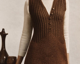 May include: A brown knitted dress with a V-neck and button details. The dress is worn over a white turtleneck sweater. The dress has a ribbed texture on the bodice and a straight skirt. The overall style is vintage and classic.