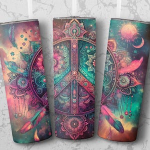 May include: Three stainless steel tumblers with a colorful peace sign design. The design features a peace sign surrounded by intricate floral patterns and feathers. The background is a gradient of pink, purple, and blue.