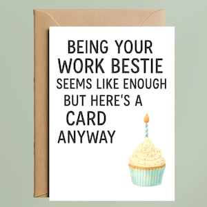May include: A white greeting card with a brown envelope featuring the black text: BEING YOUR WORK BESTIE SEEMS LIKE ENOUGH BUT HERE'S A CARD ANYWAY. Below the text is a watercolor illustration of a cupcake with a single lit candle on top.