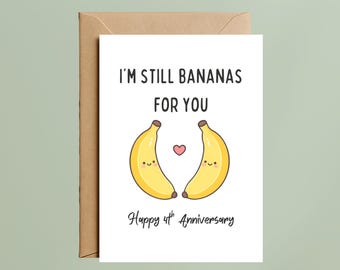 May include: A white greeting card with a brown envelope featuring two yellow cartoon bananas with smiling faces, a small pink heart between them, and the black text I'M STILL BANANAS FOR YOU and Happy 4th Anniversary printed on the front.