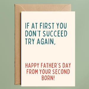 May include: A Father's Day greeting card with the message "IF AT FIRST YOU DON'T SUCCEED TRY AGAIN, HAPPY FATHER'S DAY FROM YOUR SECOND BORN!" The text is in teal and red on an off-white card, with a brown envelope.