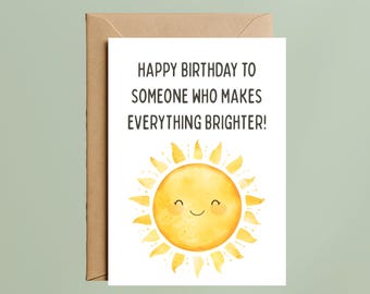 May include: A birthday greeting card with a watercolor illustration of a smiling sun. The card reads, "HAPPY BIRTHDAY TO SOMEONE WHO MAKES EVERYTHING BRIGHTER!" The card is paired with a brown envelope.