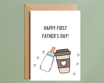 May include: A white greeting card with the black text HAPPY FIRST FATHER'S DAY! above a cartoon illustration of a baby bottle and a coffee cup with a heart icon, surrounded by small hand-drawn hearts, paired with a brown kraft paper envelope.