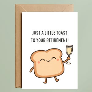 May include: A white greeting card with a brown envelope featuring a cartoon slice of bread with a smiling face, pink cheeks, and thin limbs, holding a glass of champagne. The text reads: JUST A LITTLE TOAST TO YOUR RETIREMENT!